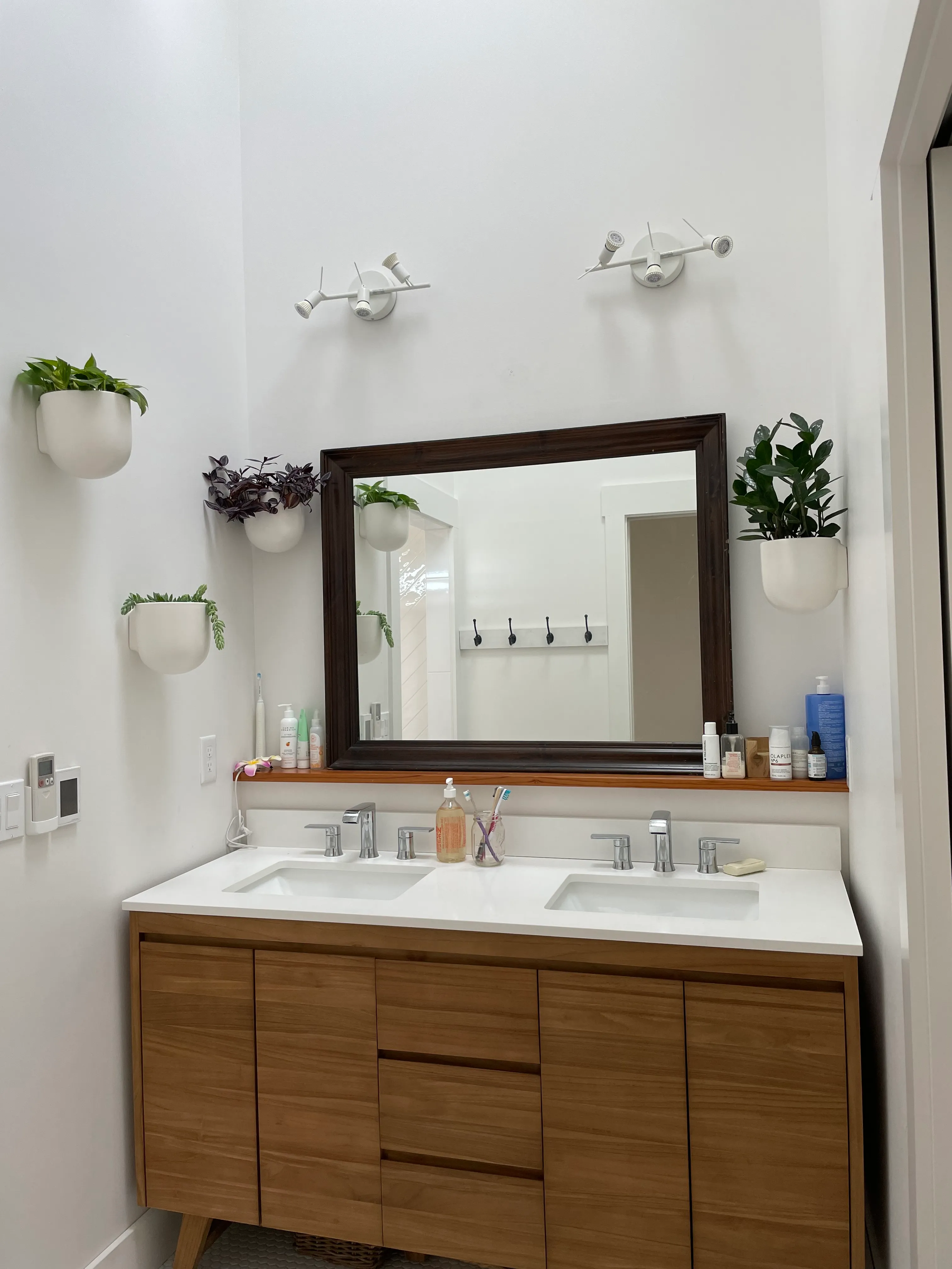 Seattle remodel vanity and mirror composition.
